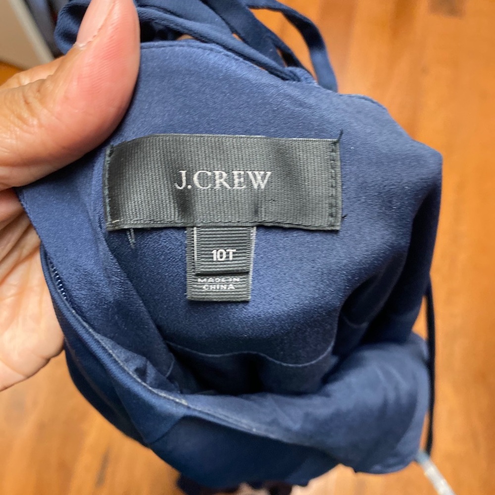 Navy satin spaghetti strap dress. Ruffle hem.